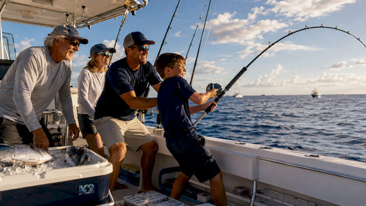 Family fishing for tuna together on boat