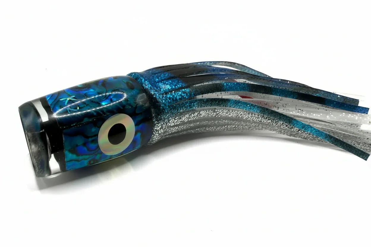 Abalone resin offshore trolling lure with blue, silver, and black skirt for tuna and marlin fishing