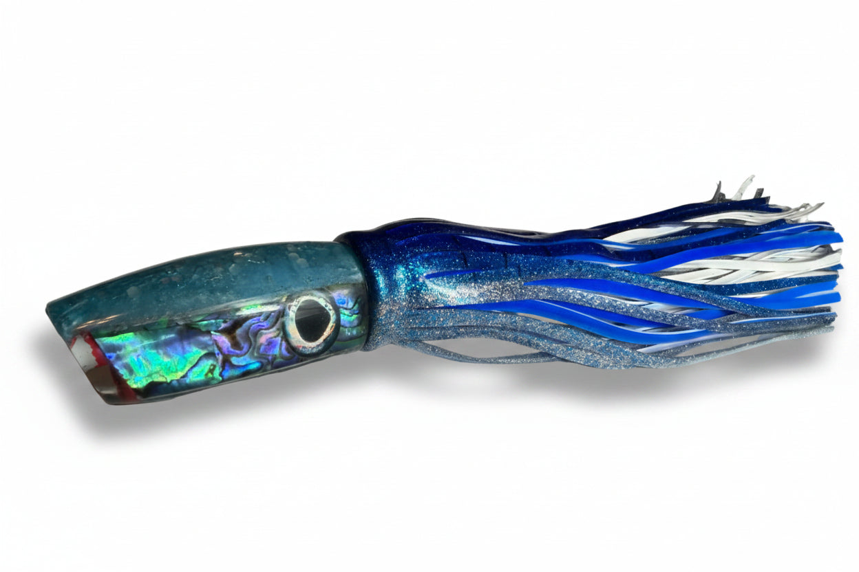 Blue and silver fishing lure on a white surface