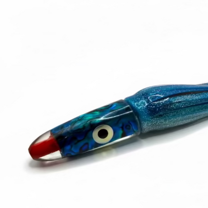 Blue and red squid fishing lure on a white background