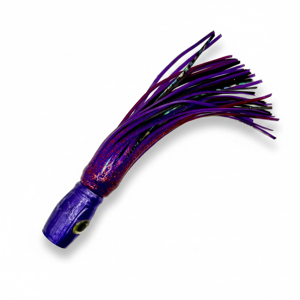 Purple offshore trolling lure with skirt and abalone accents on white background