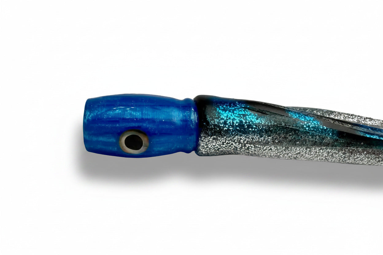 Blue and silver abalone resin offshore trolling lure with lifelike eye on white background